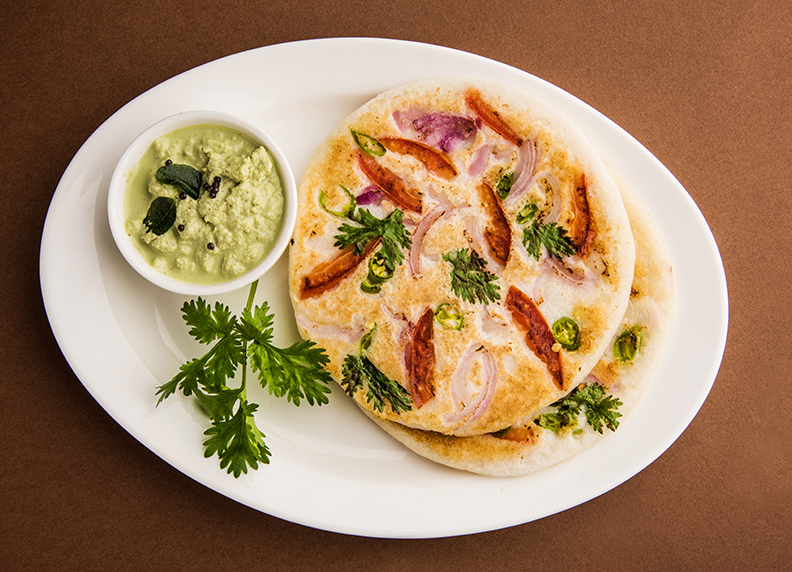Uttapam served with butter spread